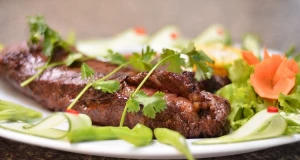 Beiried gegrillt mit Fisolen und Orangen-Koriander-Vinaigrette
